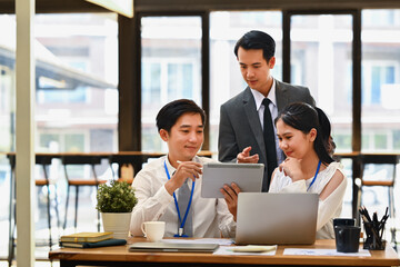 Start up business people discussing over new business project and planning marketing strategy at co working space