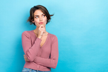 Photo of young ponder thoughtful woman wear trendy pink top touch chin look empty space distrust...