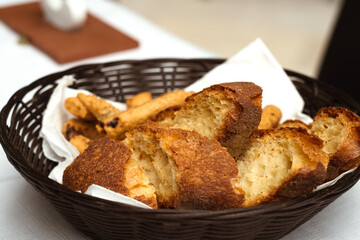 Bread basket of traditional Basilicata Italy Pane di Matera bread – loaf with a hard, dark brown crust and pale yellow crumb