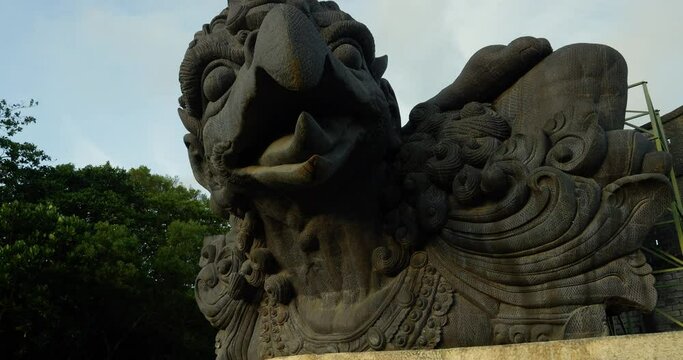 Close up dolly forward shot of the Garuda bird statue at the GWK (Garuda Wisnu Kencana) Cultural Park in Bali