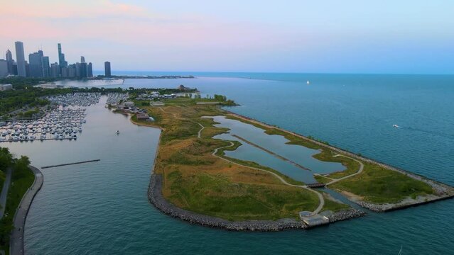 aerial drone view of Chicago metropolis from the lake during sunset.  the beautiful skyscraper showcases of the wonders of the city architecture. related to business finance and travel