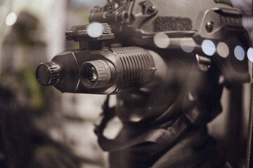 Army binoculars with night vision on a soldier's helmet. Optical device on a military helmet for tracking in war © Андрей Журавлев