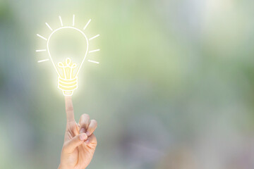 index finger points up for business idea with blub light sketch on blur background