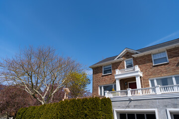 Mansion house on blue sky. Suburb architecture. Suburban housing