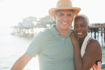 Obraz premium Portrait of happy senior couple on beach
