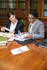 Lawyers doing research together in chambers