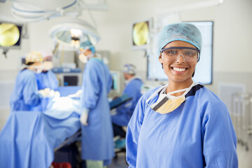 Portrait of smiling surgeon in operating room