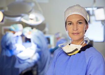 Portrait of confident surgeon in operating room
