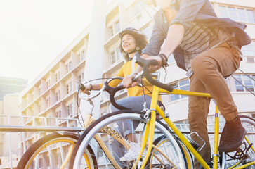 Friends riding bicycles in city