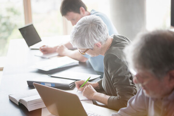 Fototapeta premium Students studying in adult education classroom