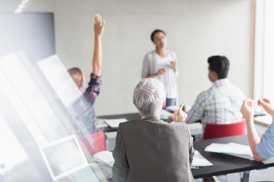 Teacher and students in adult education classroom