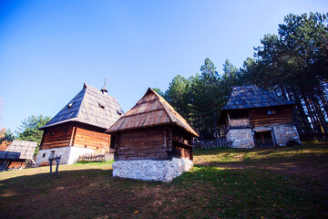 Traditional Serbian rustic wooden houses, in a peaceful village setting, Open-air Museum, cultural heritage, surrounded by nature,  Monument of Culture, Sirogojno, Serbia.