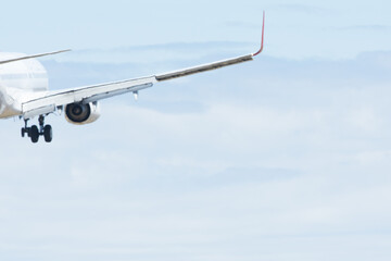 Wing of plane as it flies through the sky