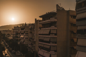 Greek apartment buildings in Athens during the sunset
