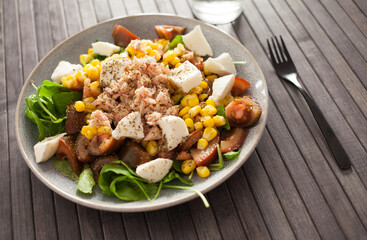 Closeup of salad with fish and vegetables for lunch