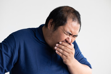 Middle aged old asian man sneezing, having sore throat irritation from cold, flu, inflammation, or infection
