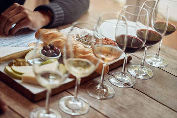 Wine tasting, cheese board and winery restaurant with alcohol and glass for customer. Eating, drink...