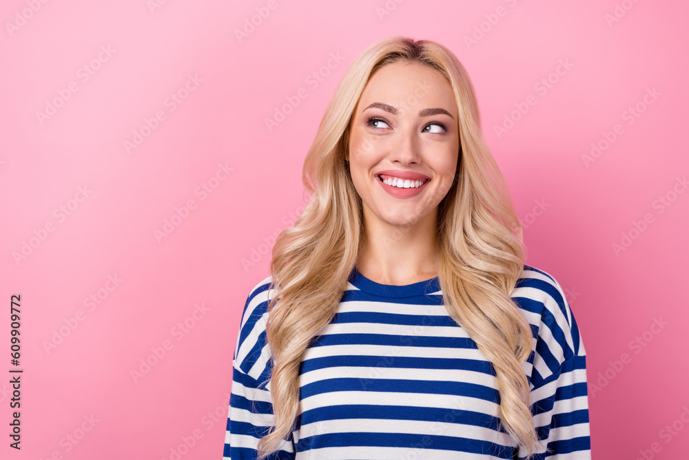 Wall mural Photo of cute dreamy woman dressed striped shirt looking empty space isolated pink color background