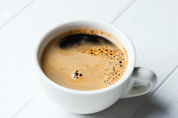 White porcelain cup with coffee