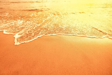 Fototapeta na wymiar surf beach sunset background surf line sand orange gold abstract wallpaper