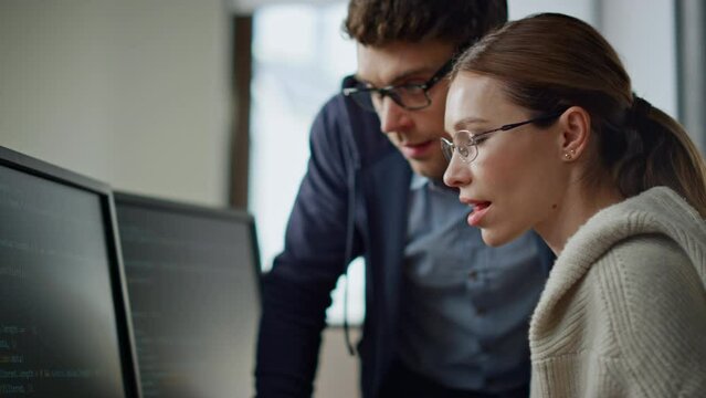 Software team consulting office closeup. It engineer supervisor teaching intern