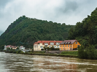 Fototapeta na wymiar Small Austrian town on the banks of the Danube in the Wachau Valley, Austria. Beautiful village at the foot of the hill