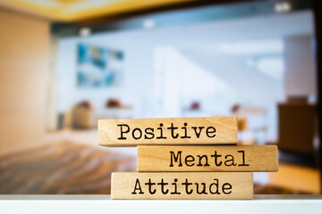 Wooden blocks with words 'Positive Mental Attitude'