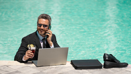 freelancer working online has phone call with laptop, advertisement. photo of freelancer