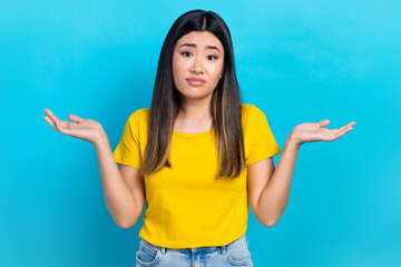 Photo of pretty clueless person raise arms palm shrug shoulders isolated on blue color background