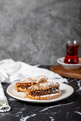 Apple cookies. Tasty cookies filled with applesauce on a dark background