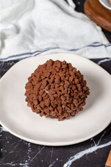 Chocolate cake. Mole cake with chocolate chips on dark background