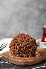 Chocolate cake. Mole cake with chocolate chips on dark background. Close up