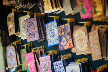 Various fabric mouse pads or hand bags on traditional Turkish market in Istanbul, Turkey