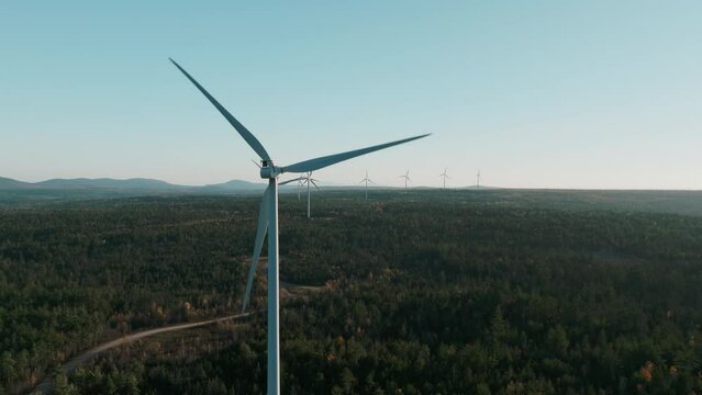 Drone Orbit of Windmill Leading to an Endless row of Windmills on the Horizon, Maine