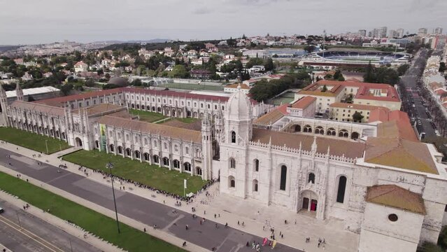 Touristic landmark Jeronimos Monastery in Lisbon Portugal cinematic aerial orbit