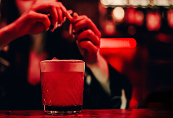 woman hand bartender making cocktail on the bar counter