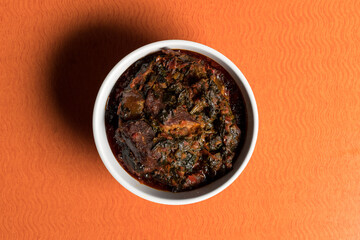 Nigerian vegetable soup made with stock fish, scotch bonnets, seasonings, meat