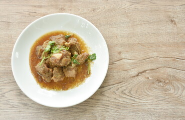 fried pork bone with garlic and pepper salty sauce on plate 