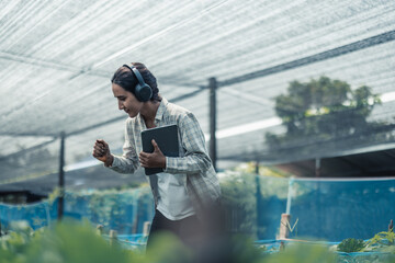Farming worker enhance healthy work-life balance by listening to music and moving body to the beat and rhythm. Designing flexible working schedule, taking breaks to rest, recharge energy and vitality
