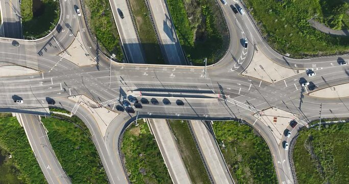 Hyderlapse aerial, drone, early morning or afternoon video of a diverging diamond interchange (DDI), located in Woodbury, NY.	