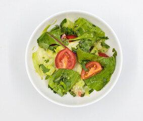 Fresh vegetable salad in a bowl. Isolate on white background