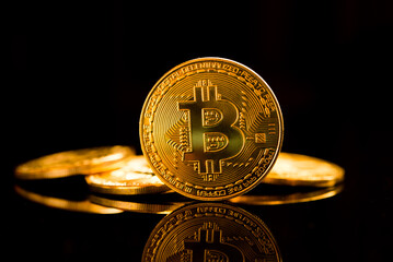 Bitcoin. Crypto currency Gold Bitcoin, BTC, Bit Coin. Macro shot of Bitcoin coins isolated on black background.