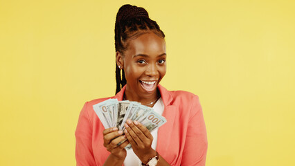 Finance, fan and winner with a black woman in studio on a yellow background holding cash, money or...