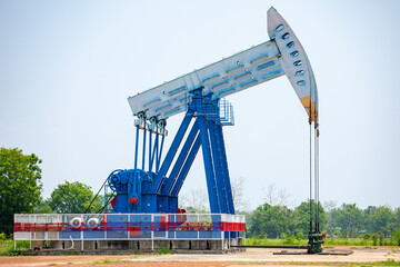 In the field country crude oil industry the oil rig pump in the evening of the pumping