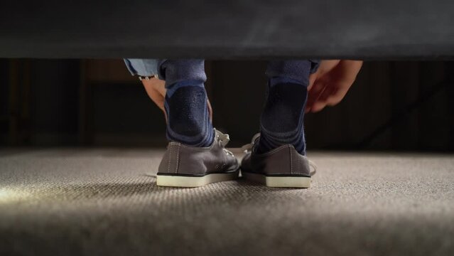 Sneakers with untying laces under the bad view in morning new day. New active day beginning concept image.