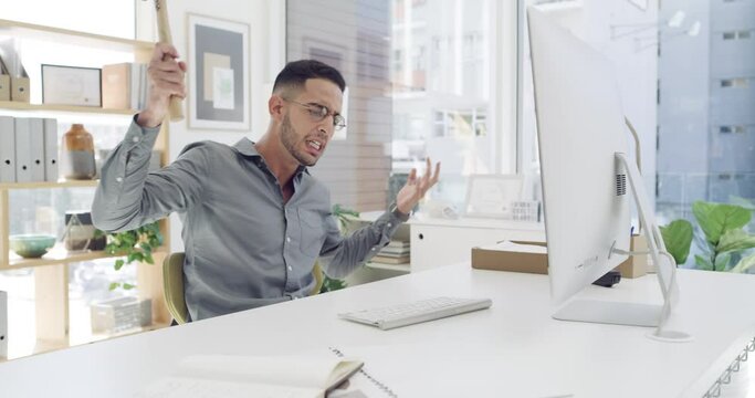 Keyboard smash, angry businessman and hammer in office with mental health problem. Frustrated, stress and burnout of a male employee with anger and workplace destruction from rage at company