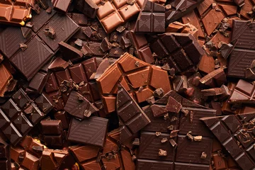 Fotobehang Broken chocolate bar texture background © Nik_Merkulov