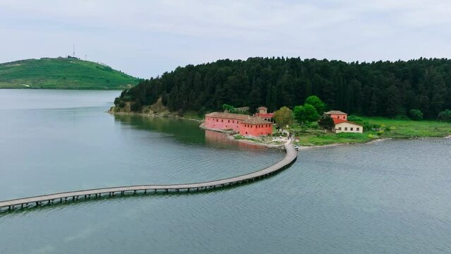 Drone aerial view on isolated Monastery of Saint Mary on Zvernec island. Narta Lagoon, Vlore, Albania