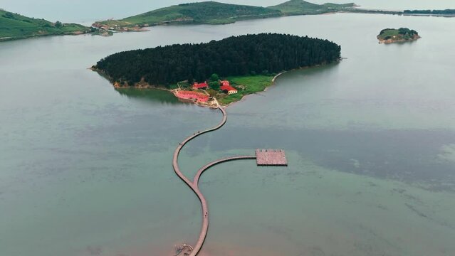 Drone aerial view on isolated Monastery of Saint Mary on Zvernec island. Narta Lagoon, Vlore, Albania