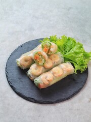 Fresh summer rolls with shrimp and vetgetables,Vietnamese food for healthy food concept with salad dressing
